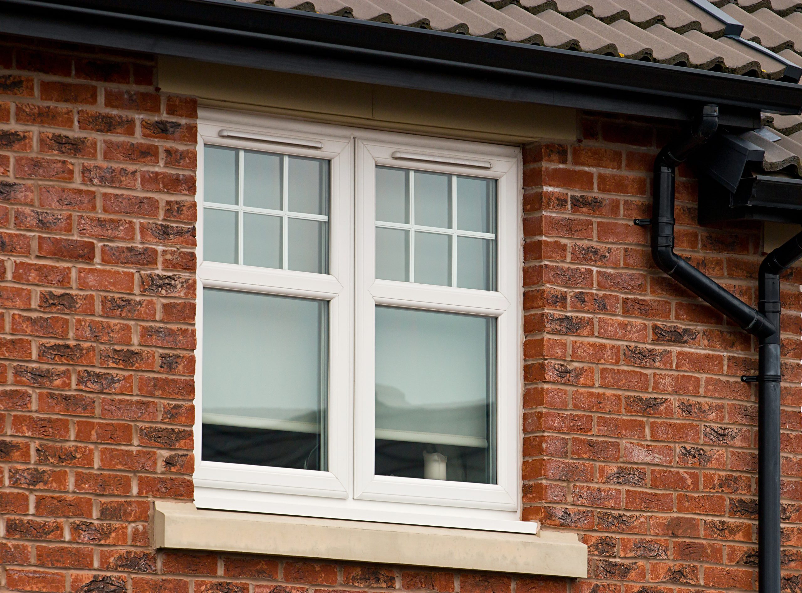 Casement windows in brick wall